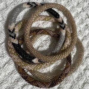 5 Sashka Co handcrafted beaded bracelets. Neutral colors. Approx 8”.